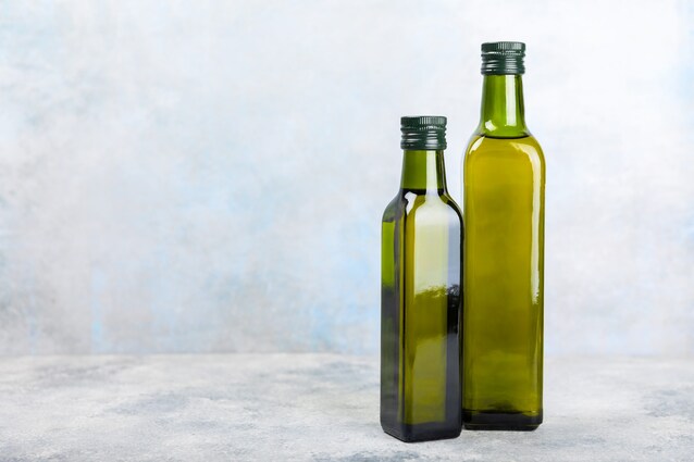 olio in bottiglie scure